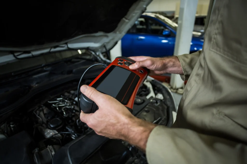 hands mechanic using diagnostic tool 1 Mobile Mechanic